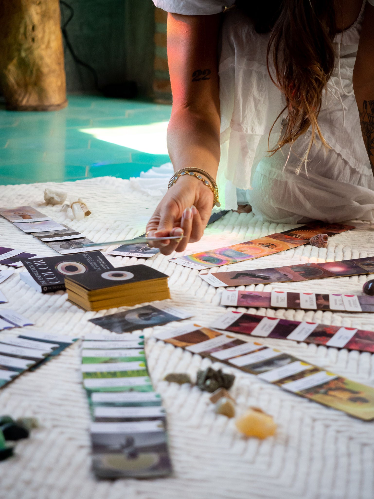 The Energetics of Color: model pulling a card from a deck, card setup